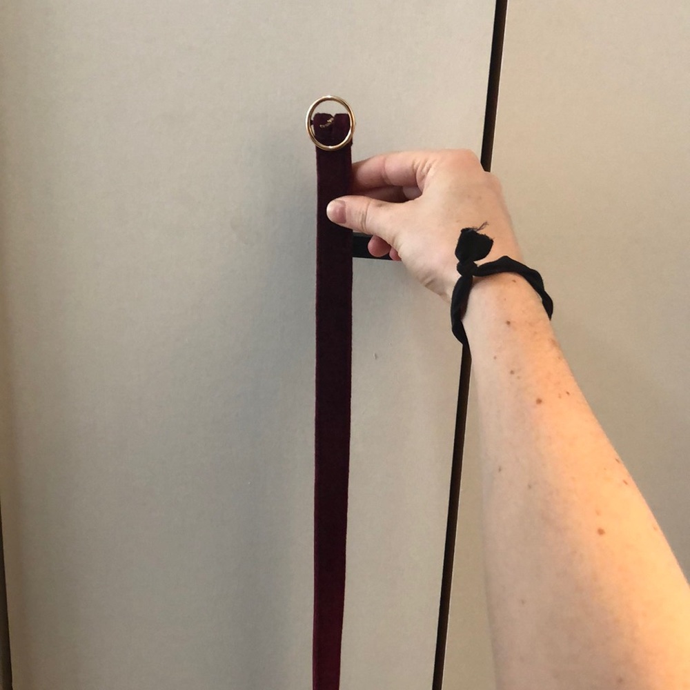 Maroon velvet belt with gold accents